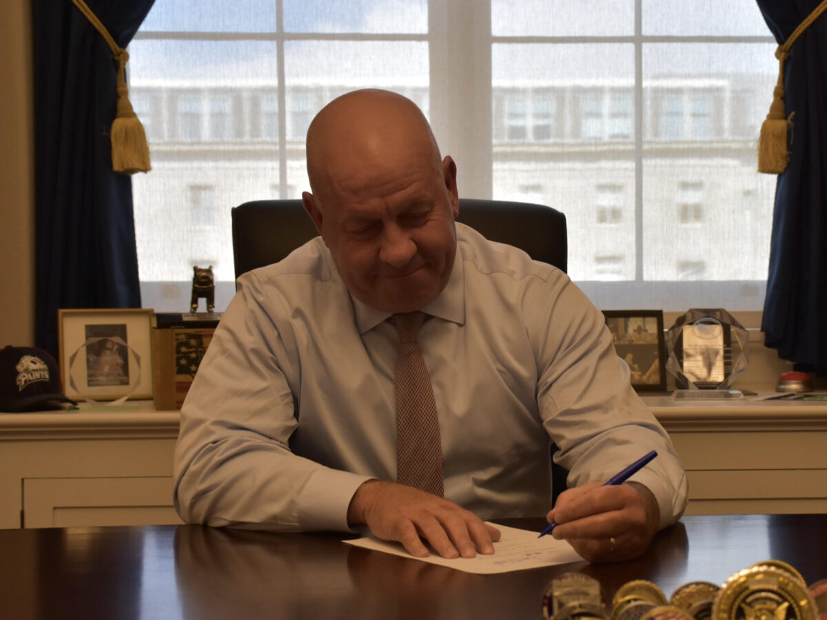 Congressman Dave Taylor signs his support onto a bill that would uncover SNAP fraud.