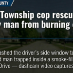 Miami Township cop pulls man from burning car